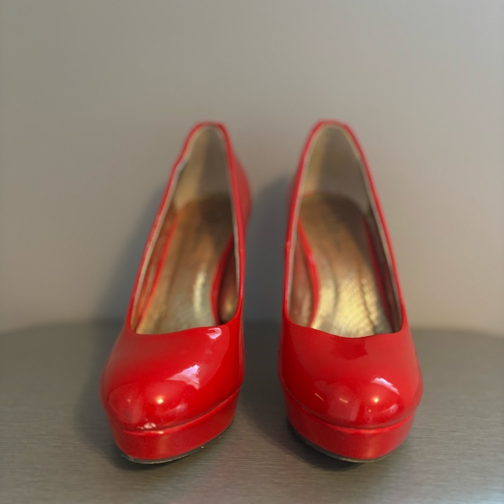 Beautiful red shoes with gold zipper detail on heel